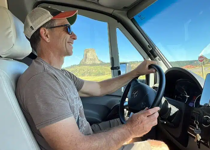 marc drives rv with devils tower behind