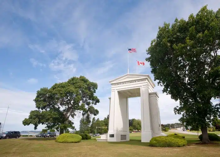 canadian usa border crossing peace arch with flags
