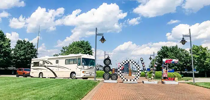 Is virgiina for lovers of rvs and racing. Rv parked next to racing themed love works sign in virginia