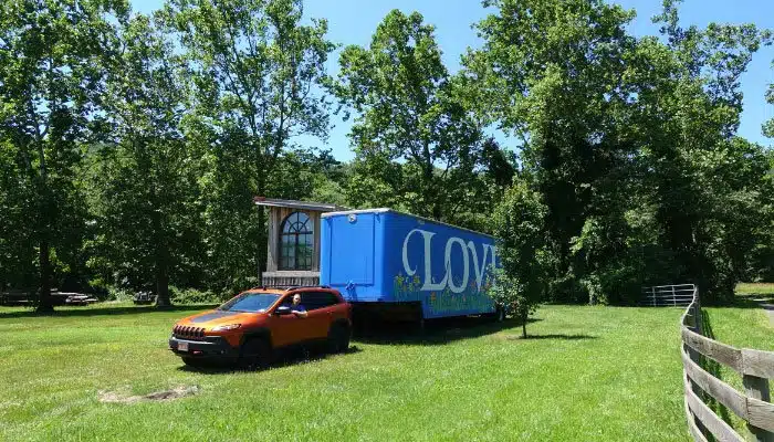 Virginia love works sign made from semi trailer with Jeep pretending to tow it