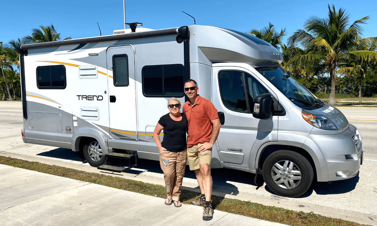 couple stand with RV Rental in key west florida