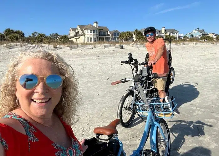 man and with ebikes on beach