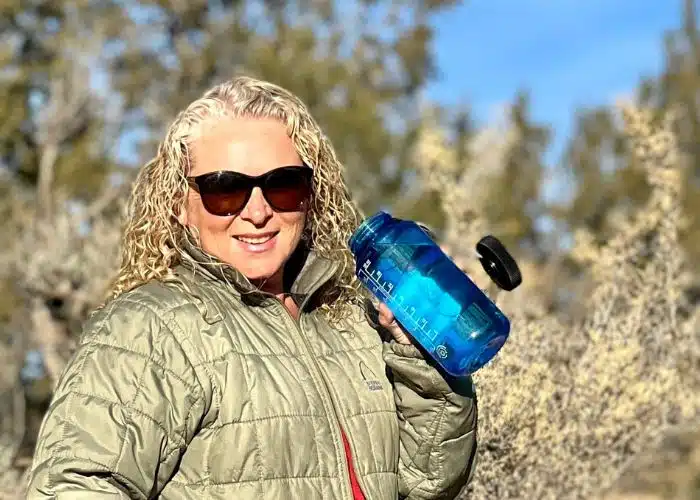 woman with blue water bottle
