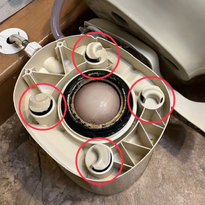 RV TOILET INSIDE WITH RED CIRCLES showing tabs