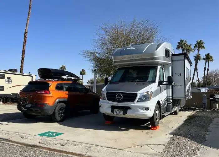 class c rv and jeep in campsite at palm springs oasis