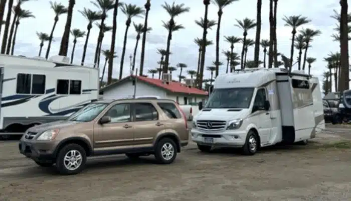 Honda CRV and Class C RV with palm trees