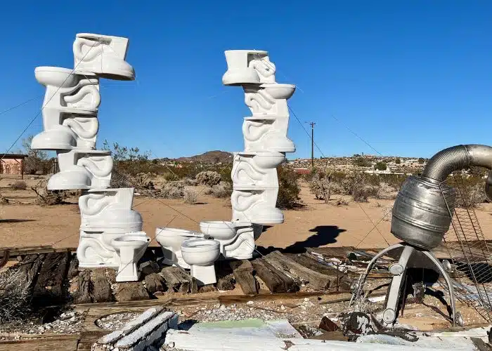 an art installation made of toilets in a U-shape