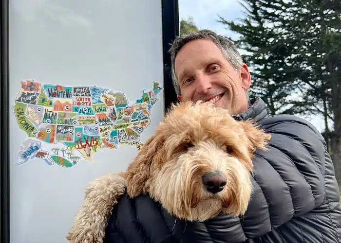 marc and dog sunny with state sticker map