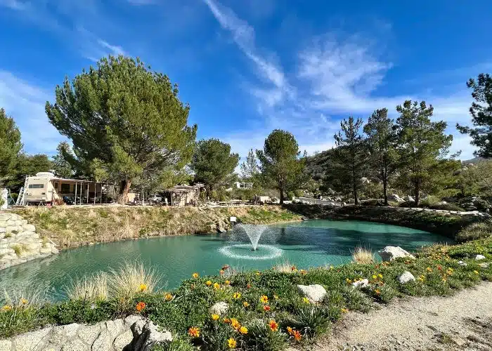 one of many ponds at jojoba hills with a water fountain