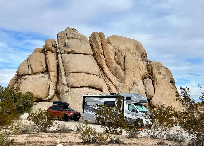 rv and jeep in joshua tree belle with foreground plants