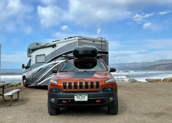 rv and jeep parked in beachfront campsite at faria park