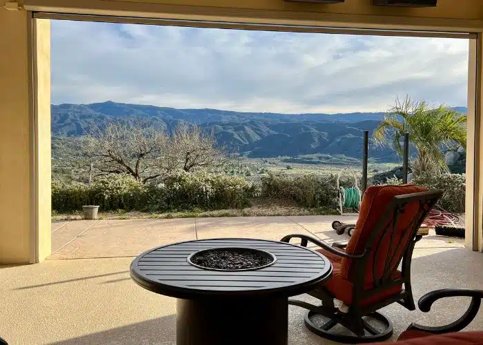 view across valley by fire pit and chair jojoba hills