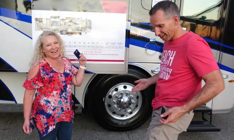 1250 x 750 marc and julie in front of rv holding credit card and empty pockets