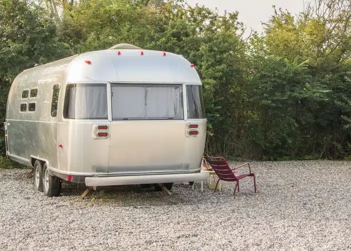 airstream parked with front against trees would need a dolly