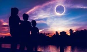 feature image 1250x750 family at dusk viewing solar eclipse