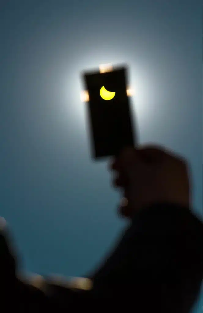 vertical solar eclipse viewed on iphone