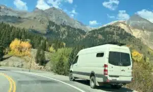 van parked on side of scenic mountain road