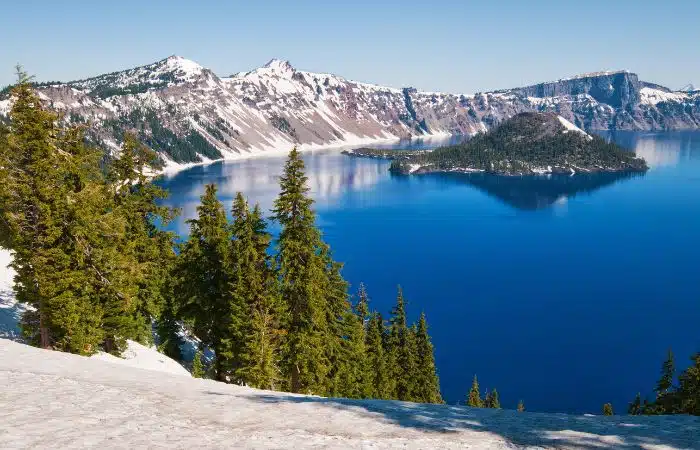 crater lake with snow caps