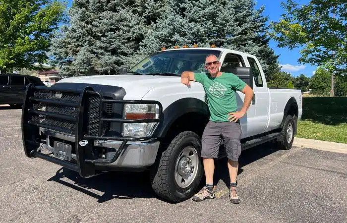 Marc stands by ford f250 truck
