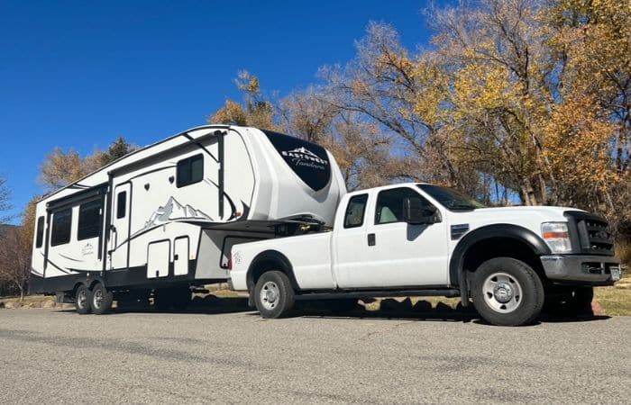 white truck and fifth wheel