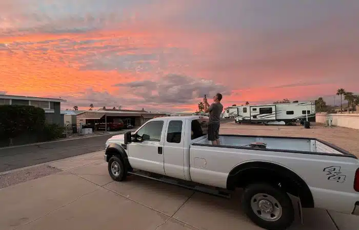 Marc in truck bed capturing sunset
