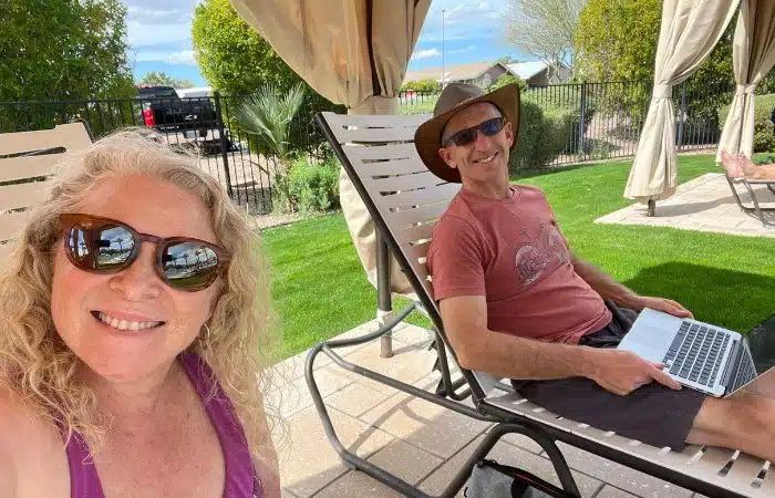 marc and julie sit by pool at viewpoint rv resort