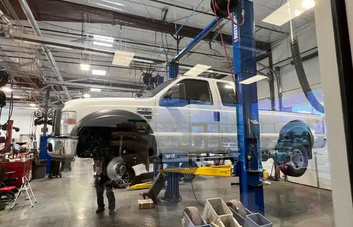 Truck on lift getting new brakes