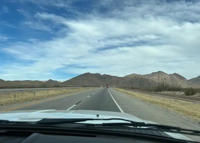 pen road white truck hood scenic rocky mountains ahead