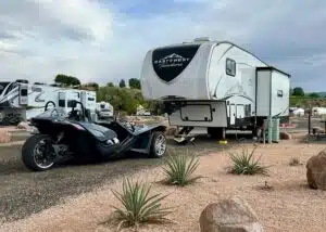 slingshot parked in front of fifth wheel rv at camp eddy grand junction co