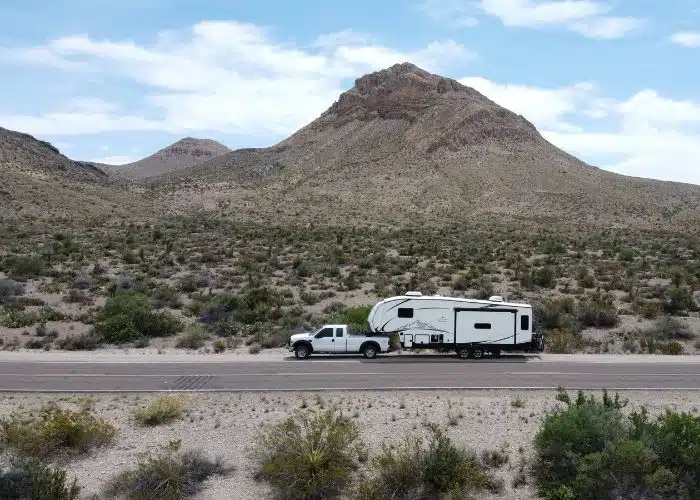 truck and fifth wheel parked on road outside of. big bend national park tx